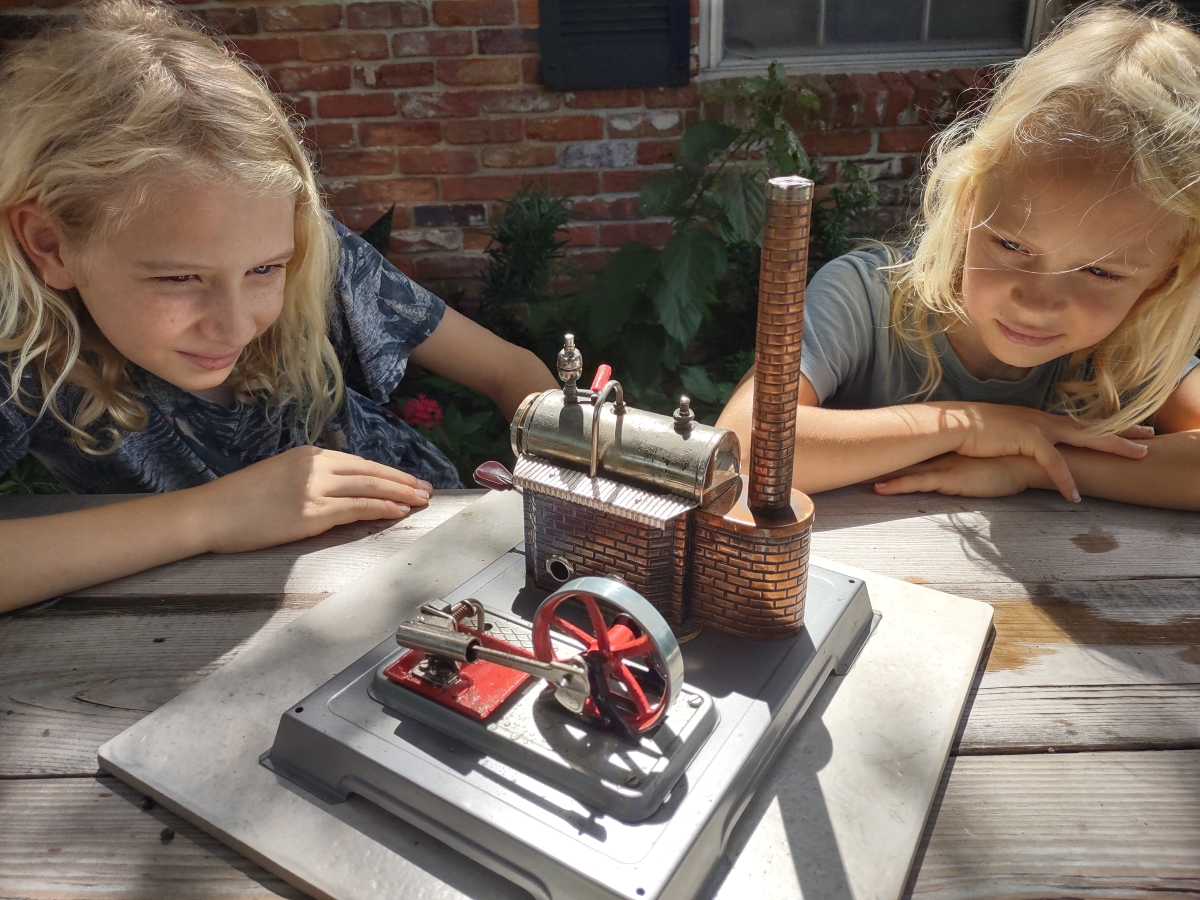 Kids learning how a steam engine works